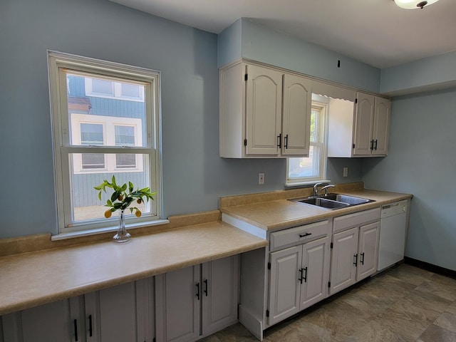 2928 Ridgeway Ave, Rockford, IL 61101 - kitchen with dishwasher, light countertops, and white cabinetry
