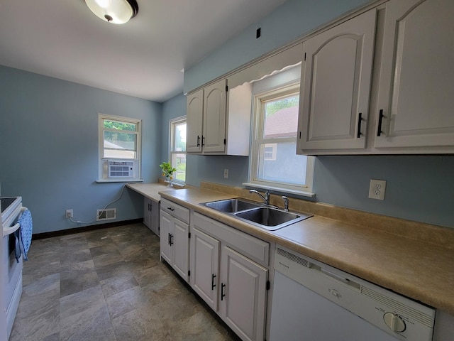 2928 Ridgeway Ave, Rockford, IL 61101 - kitchen with white appliances, stone finish floors, light countertops, and white cabinets