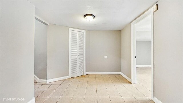 309 W 109th Pl, Chicago, IL 60628 - empty room featuring light tile patterned floors and baseboards