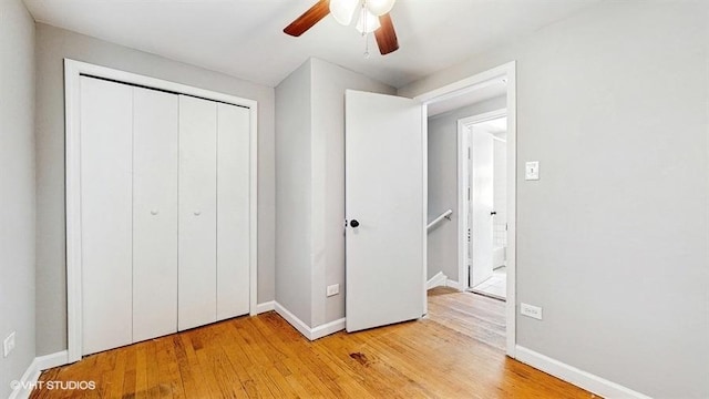 309 W 109th Pl, Chicago, IL 60628 - unfurnished bedroom with light wood-style flooring, a closet, and ceiling fan