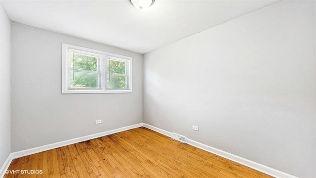 309 W 109th Pl, Chicago, IL 60628 - empty room with baseboards and light wood-style floors