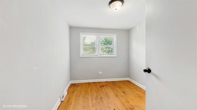 309 W 109th Pl, Chicago, IL 60628 - unfurnished room featuring light wood-type flooring and baseboards