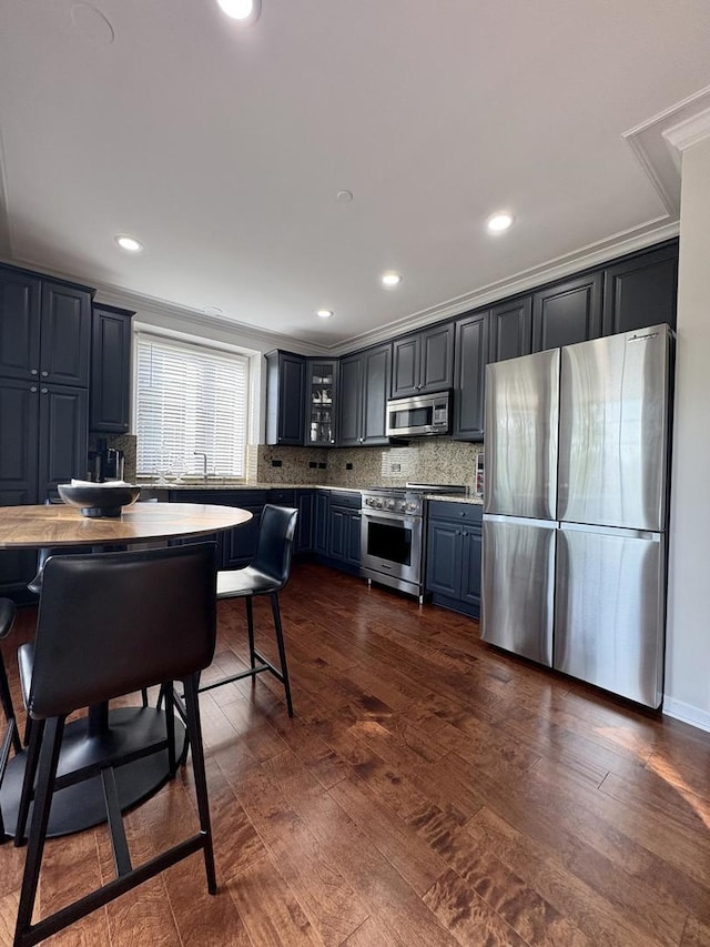 17 Harborside Way, Hawthorn Woods, IL 60047 - kitchen featuring appliances with stainless steel finishes, dark wood-style floors, glass insert cabinets, backsplash, and recessed lighting