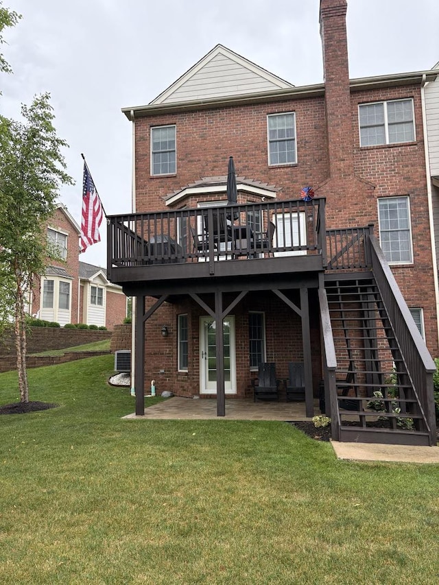17 Harborside Way, Hawthorn Woods, IL 60047 - back of house featuring a wooden deck, brick siding, a patio, and a chimney