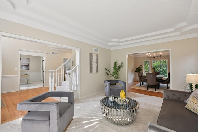1123 Thackery Ln, Naperville, IL 60564 - living area featuring a chandelier, a tray ceiling, stairway, light wood finished floors, and ornamental molding