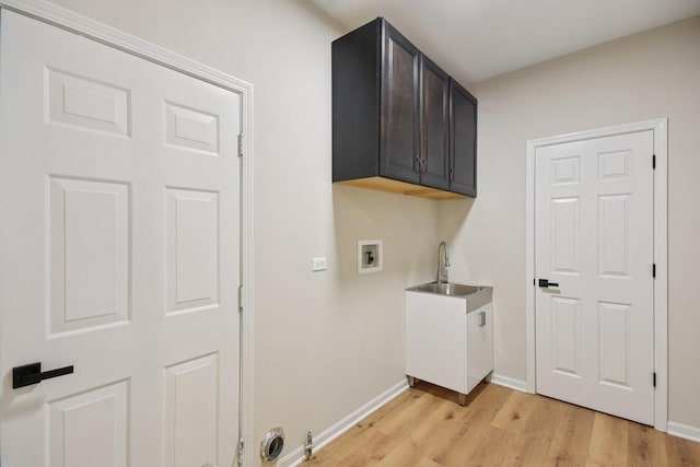 1123 Thackery Ln, Naperville, IL 60564 - laundry area with hookup for a washing machine, light wood finished floors, and cabinet space