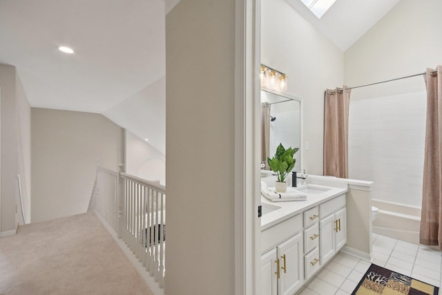 1123 Thackery Ln, Naperville, IL 60564 - full bath featuring double vanity, vaulted ceiling, a skylight, shower / bath combination with curtain, and tile patterned floors
