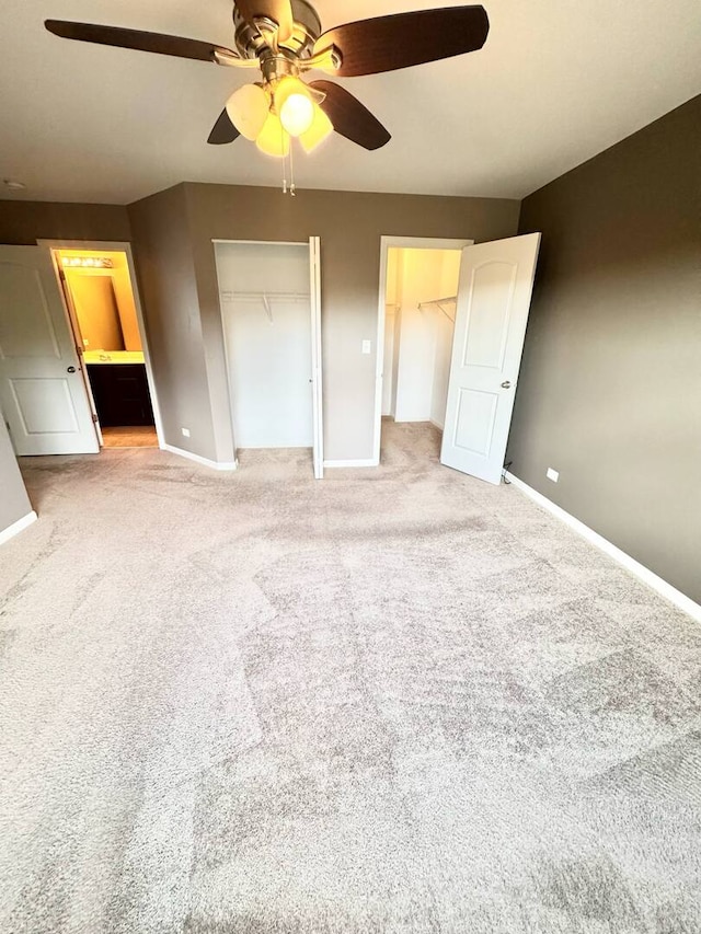5 Boathouse Rd, Pingree Grove, IL 60140 - unfurnished bedroom with light carpet, multiple closets, and ceiling fan