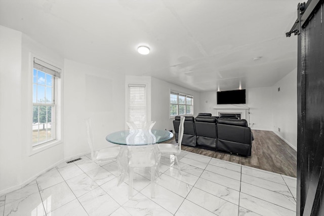 3032 Sandy Ridge Dr, Steger, IL 60475 - dining space featuring light marble finish flooring and a fireplace