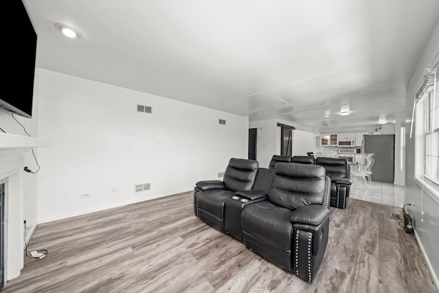 3032 Sandy Ridge Dr, Steger, IL 60475 - home theater with light wood-style flooring and a fireplace