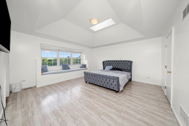3032 Sandy Ridge Dr, Steger, IL 60475 - bedroom featuring a skylight, wood finished floors, lofted ceiling, and a raised ceiling