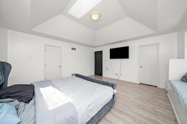 3032 Sandy Ridge Dr, Steger, IL 60475 - bedroom with light wood finished floors, a skylight, and a raised ceiling