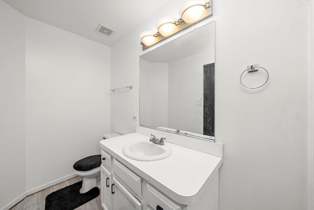 3032 Sandy Ridge Dr, Steger, IL 60475 - half bath featuring vanity and wood finished floors