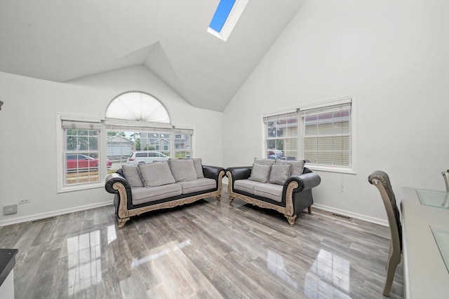 3032 Sandy Ridge Dr, Steger, IL 60475 - living area featuring a skylight, wood finished floors, and high vaulted ceiling