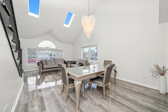3032 Sandy Ridge Dr, Steger, IL 60475 - dining area with a skylight, a chandelier, wood finished floors, and high vaulted ceiling