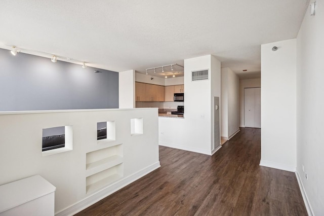 512 N Mcclurg Ct Unit 4302, Chicago, IL 60611 - kitchen featuring track lighting, built in shelves, dark wood finished floors, stove, and black microwave