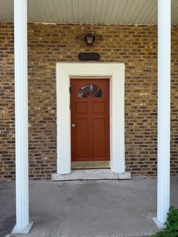 3608 Jackson St Unit 2E, Bellwood, IL 60104 - view of exterior entry featuring brick siding and covered porch