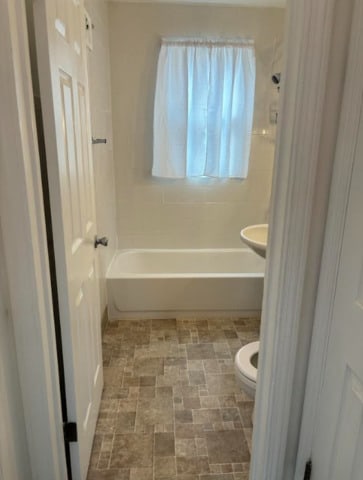 3608 Jackson St Unit 2E, Bellwood, IL 60104 - bathroom featuring toilet and bathtub / shower combination