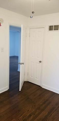 3608 Jackson St Unit 2E, Bellwood, IL 60104 - empty room with baseboards and dark wood-style flooring