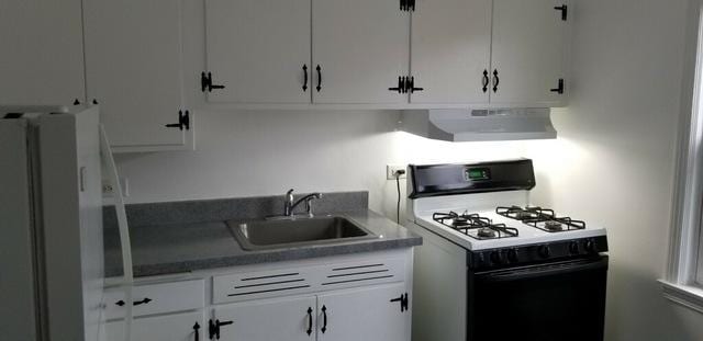 3608 Jackson St Unit 2E, Bellwood, IL 60104 - kitchen featuring white appliances, under cabinet range hood, and white cabinetry