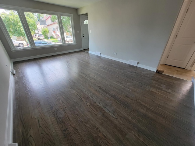 6308 W Cornelia Ave, Chicago, IL 60634 - unfurnished room featuring dark wood finished floors and baseboards