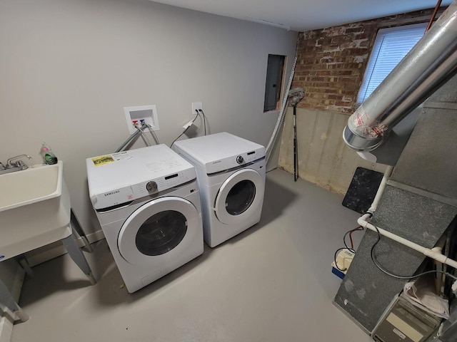 6308 W Cornelia Ave, Chicago, IL 60634 - washroom with electric panel, washer and clothes dryer, and brick wall