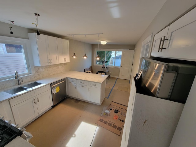 6308 W Cornelia Ave, Chicago, IL 60634 - kitchen featuring stainless steel dishwasher, white cabinetry, backsplash, a peninsula, and decorative light fixtures