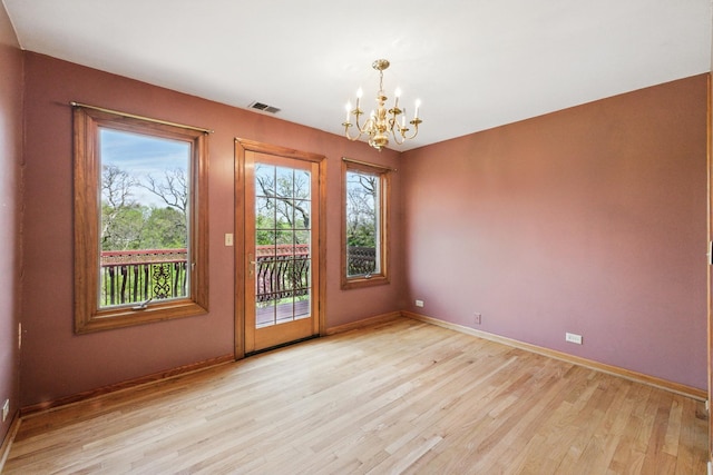 3664 E 2619th Rd, Sheridan, IL 60551 - empty room featuring a chandelier and light wood-type flooring