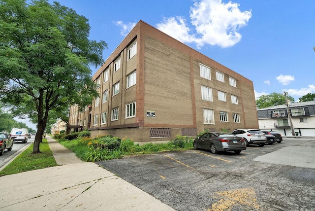 10048 S Pulaski Rd Unit 3F, Oak Lawn, IL 60453 - view of building exterior with uncovered parking