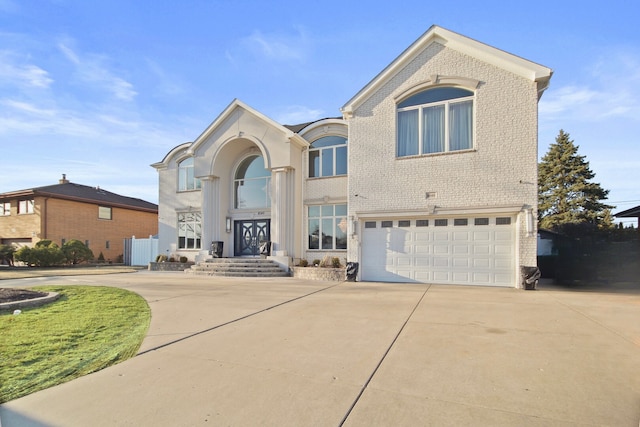 8040 W Balmoral Ave, Norwood Park Township, IL 60631 - view of front of house with driveway, an attached garage, and brick siding