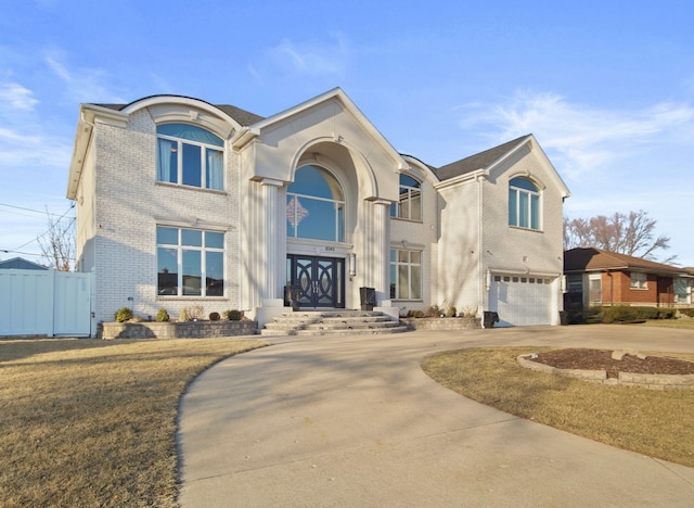 8040 W Balmoral Ave, Norwood Park Township, IL 60631 - view of front facade with brick siding, an attached garage, and concrete driveway