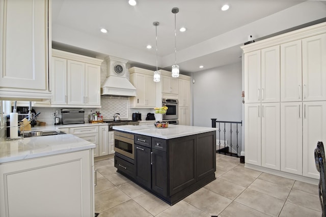 8040 W Balmoral Ave, Norwood Park Township, IL 60631 - kitchen with appliances with stainless steel finishes, custom exhaust hood, decorative backsplash, light tile patterned floors, and dark cabinets