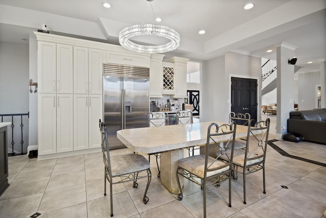 8040 W Balmoral Ave, Norwood Park Township, IL 60631 - dining room with light tile patterned floors, recessed lighting, and a tray ceiling