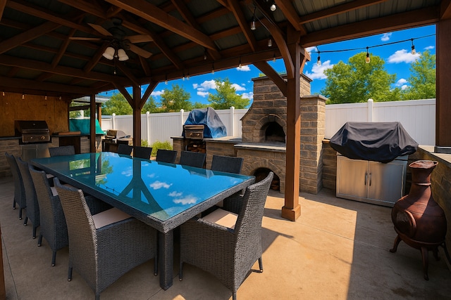 8040 W Balmoral Ave, Norwood Park Township, IL 60631 - fenced backyard with an outdoor kitchen, outdoor dining space, a patio area, an outdoor stone fireplace, and a gazebo