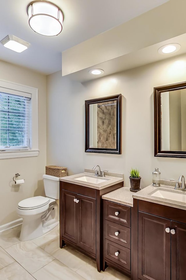 1194 Oxford Ct, Highland Park, IL 60035 - bathroom featuring two vanities and recessed lighting
