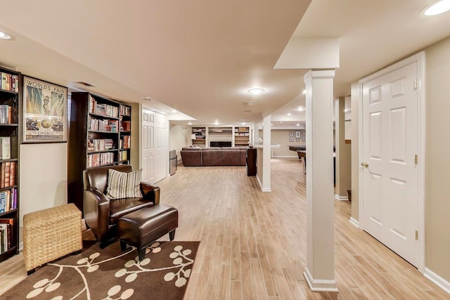 1194 Oxford Ct, Highland Park, IL 60035 - living area with light wood-style flooring, ornate columns, and recessed lighting