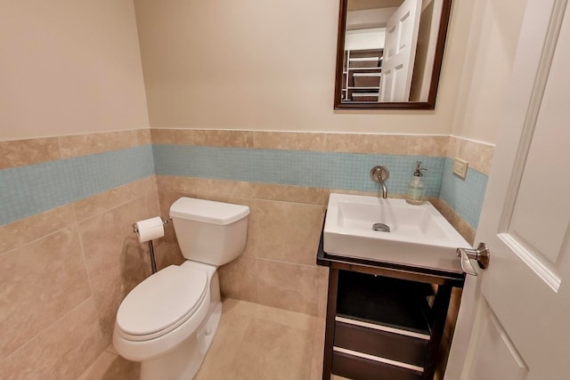 1194 Oxford Ct, Highland Park, IL 60035 - half bath with vanity, tile walls, and a wainscoted wall