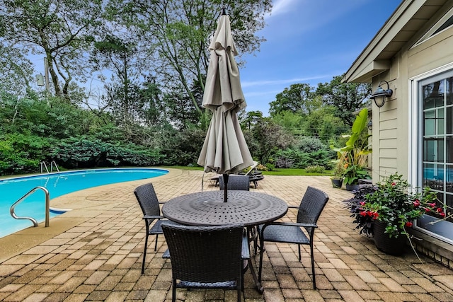 1194 Oxford Ct, Highland Park, IL 60035 - view of patio with an outdoor pool and view of scattered trees