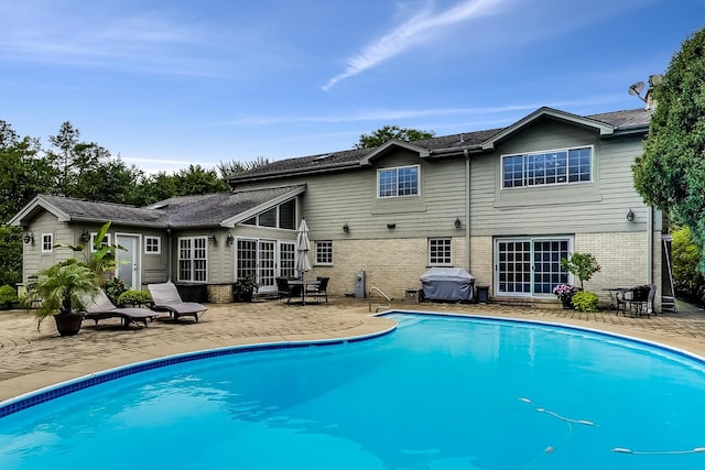 1194 Oxford Ct, Highland Park, IL 60035 - outdoor pool with a patio and a grill