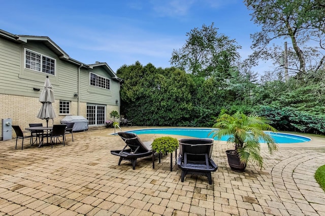 1194 Oxford Ct, Highland Park, IL 60035 - view of patio / terrace featuring area for grilling, an outdoor pool, and view of wooded area