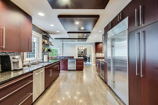 1194 Oxford Ct, Highland Park, IL 60035 - kitchen with appliances with stainless steel finishes, modern cabinets, light wood-style flooring, and recessed lighting