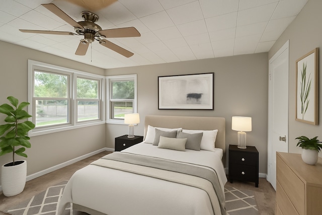 bedroom with multiple windows and a ceiling fan
