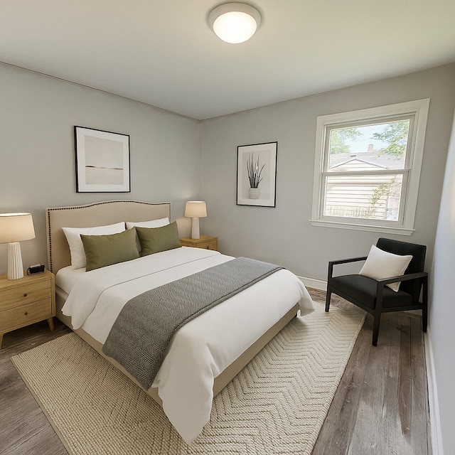 bedroom with wood finished floors and baseboards