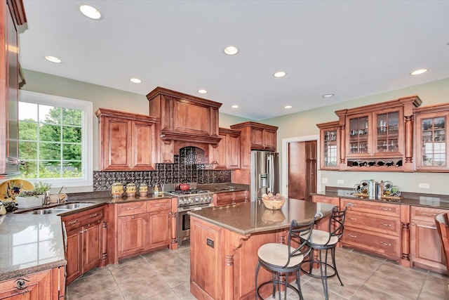 24155 S Blackhawk Ln, Manhattan, IL 60442 - kitchen featuring stainless steel appliances, a kitchen island, recessed lighting, a kitchen breakfast bar, and light tile patterned floors
