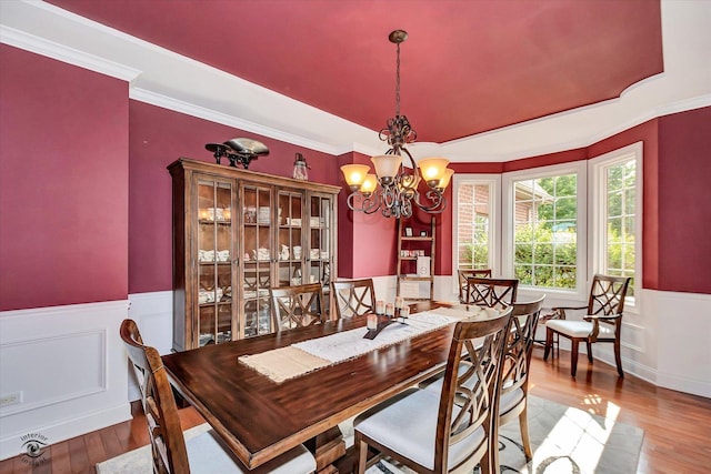 24155 S Blackhawk Ln, Manhattan, IL 60442 - dining space with wainscoting, a chandelier, wood finished floors, and ornamental molding