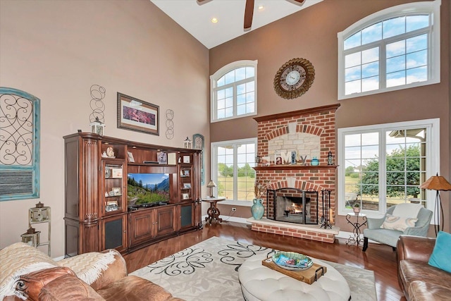 24155 S Blackhawk Ln, Manhattan, IL 60442 - living area with high vaulted ceiling, ceiling fan, wood finished floors, a fireplace, and recessed lighting