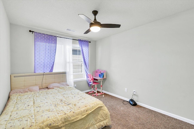 412 Doisy Ln, Champaign, IL 61822 - carpeted bedroom featuring ceiling fan and a textured ceiling