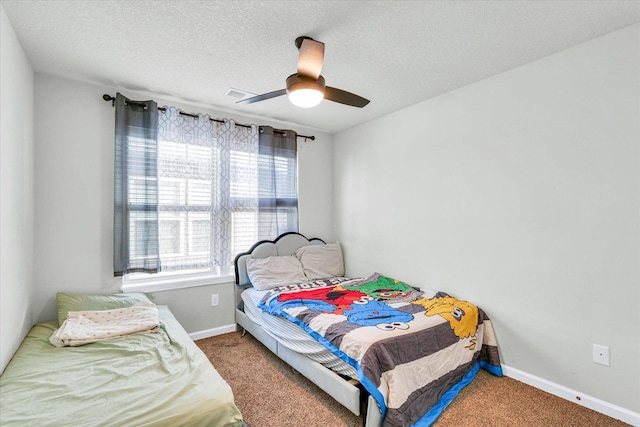 412 Doisy Ln, Champaign, IL 61822 - carpeted bedroom featuring ceiling fan and a textured ceiling