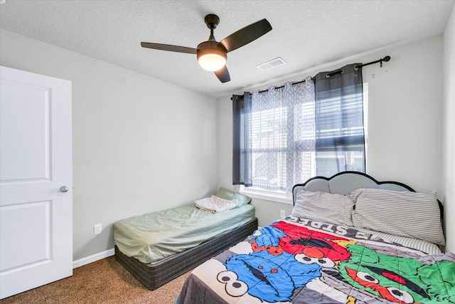 412 Doisy Ln, Champaign, IL 61822 - bedroom featuring carpet floors, a textured ceiling, and ceiling fan