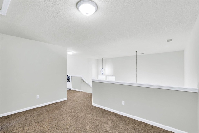 412 Doisy Ln, Champaign, IL 61822 - unfurnished room featuring dark colored carpet and a textured ceiling
